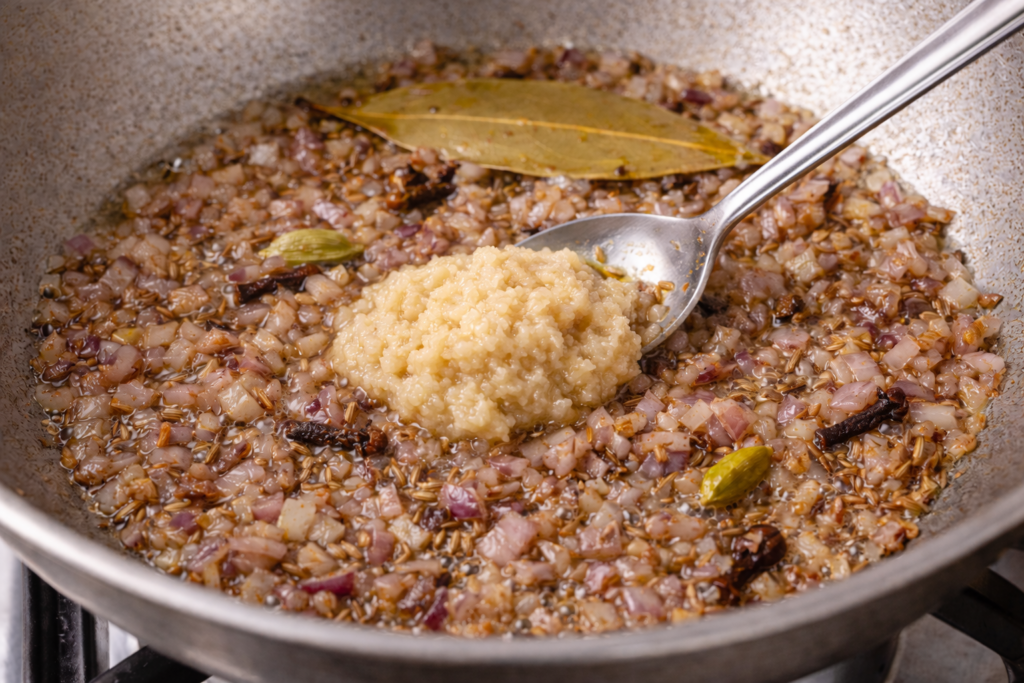 Saute-onions-and-garlic-for-chicken-masala